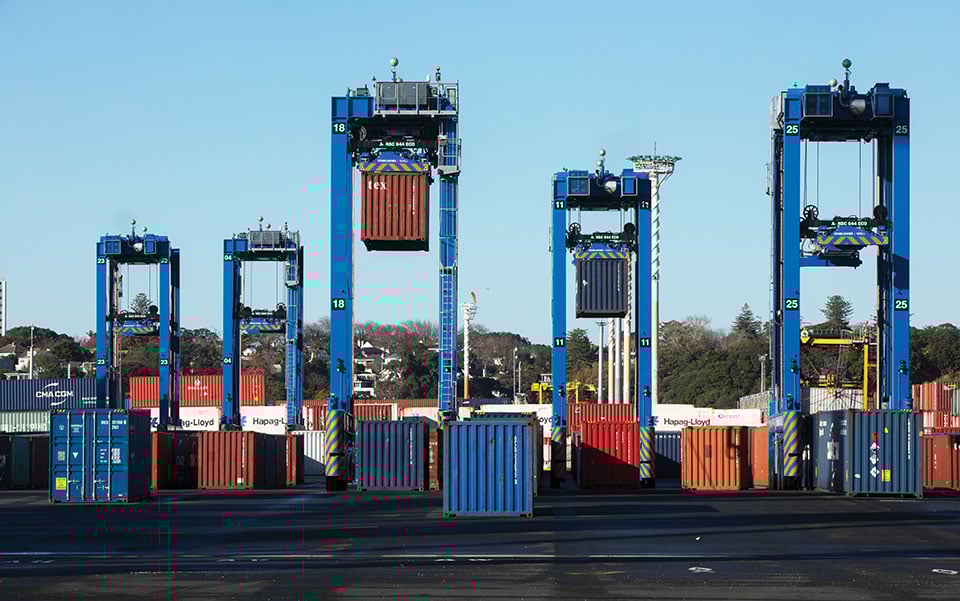 Five fully autonomous Konecranes A-STRADs at work in the Ports of Auckland. The Locata VRay Orb antennas can be seen at the top of each straddle. (Photo: Photo: Ross Clark/Ports of Auckland)