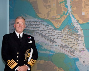 Admiral Sir Alan West, then First Sea Lord, is pictured with the official chart of anchorages for the International Fleet Review. (Photo: DP Kilfeather's book Trafalgar 200 Through the Lens Queen Elizabeth II 80th Birthday Edition, CC BY-SA 2.5)